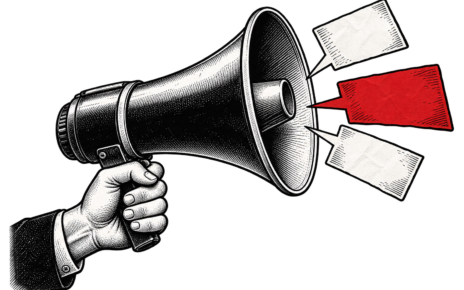 A hand holds a megaphone with three paper speech cards, including one red card.